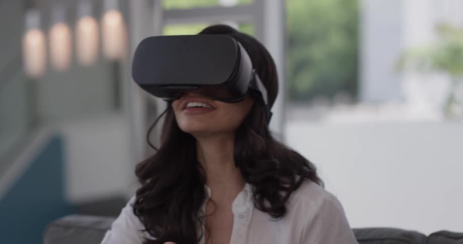 A woman is using virtual reality at home