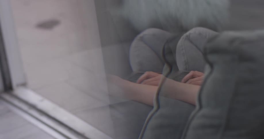 Woman In Apartment Using Electronics