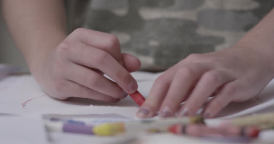 A person coloring with a crayon