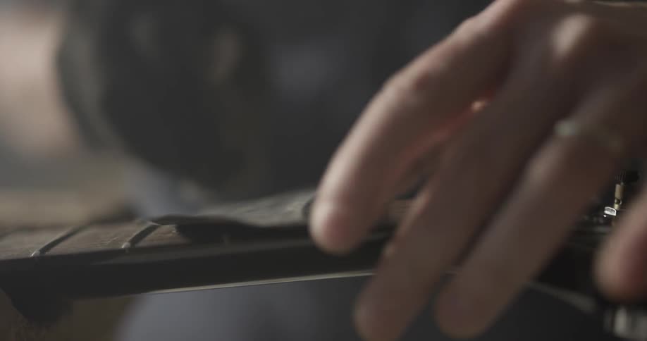 A person is polishing a guitar strap