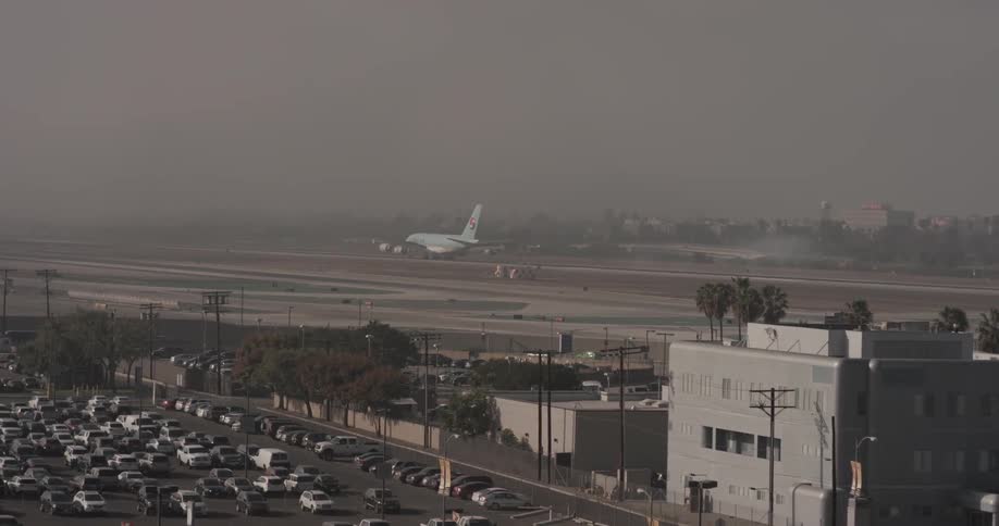 A jet travels on an airport landing strip