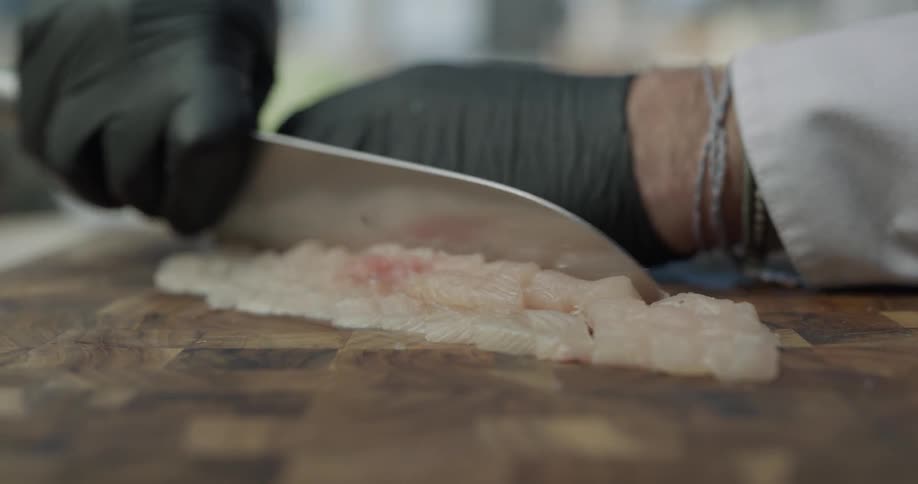 A person is cutting food with a knife
