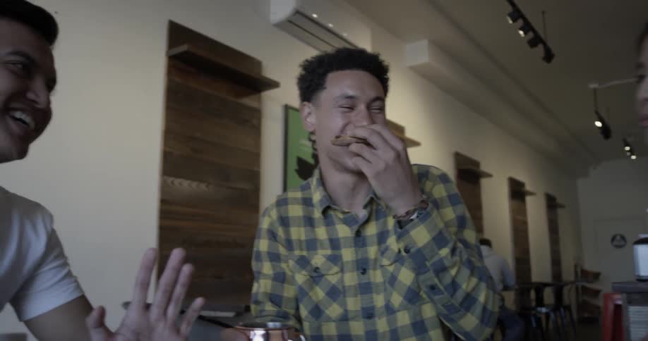 A man is eating others at a dinner table