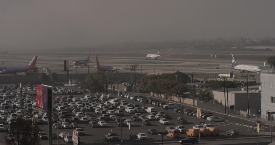 Outside of airport with multiple planes