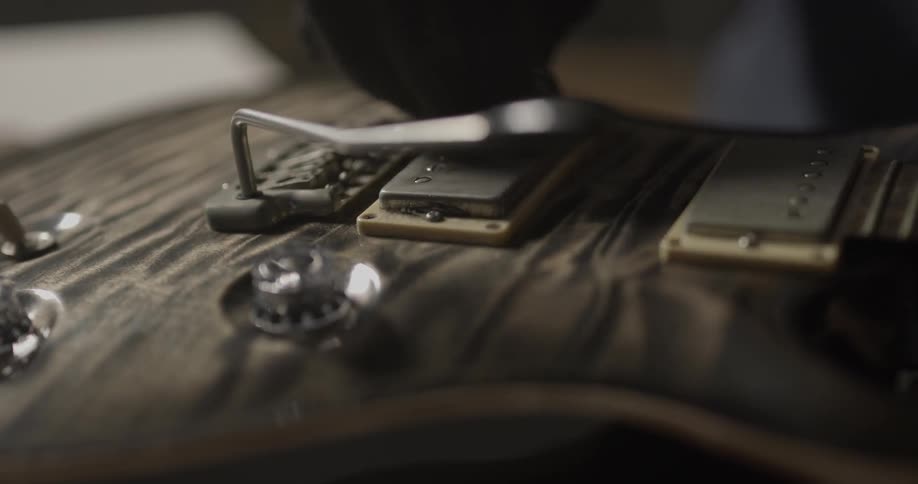A person repairing a guitar