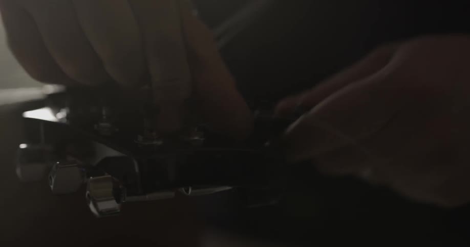 Adding strings to a guitar