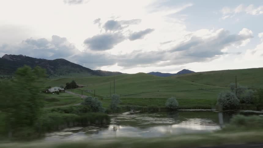 A vehicle driving through a rural area