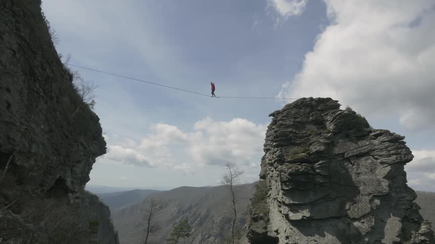 A person tightrope walking