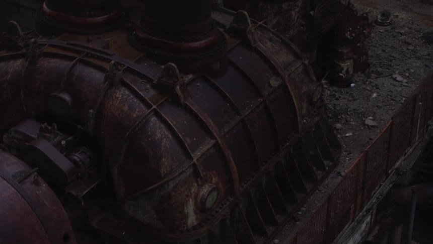 Rusted storage tanks attached to double vents