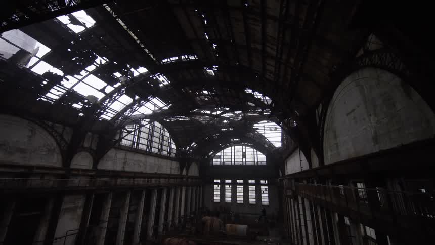 The arched ceiling of a dilapidated building