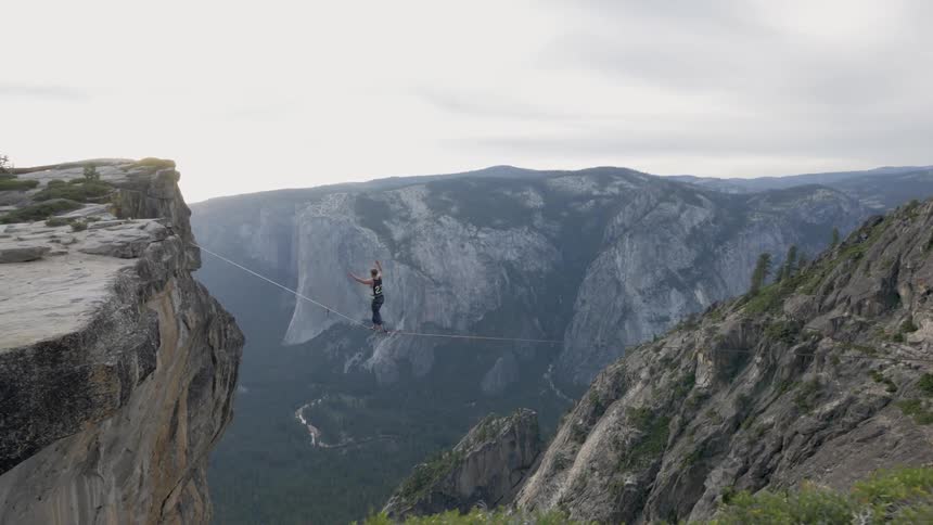 A person tightrope walking