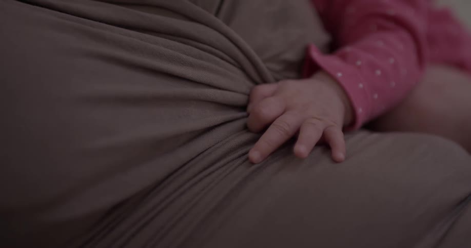Baby grasps sheet