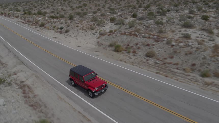 A person is driving a car on a road