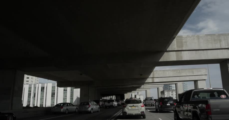 Cars pack the highway during the day