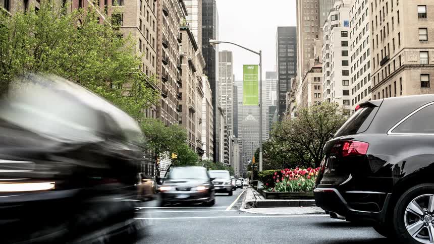 Time lapse of busy city street with buildings