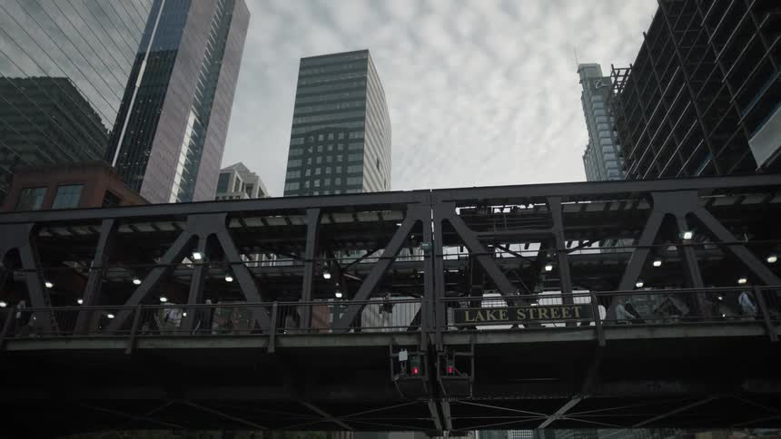 A view under a steel bridge above the river