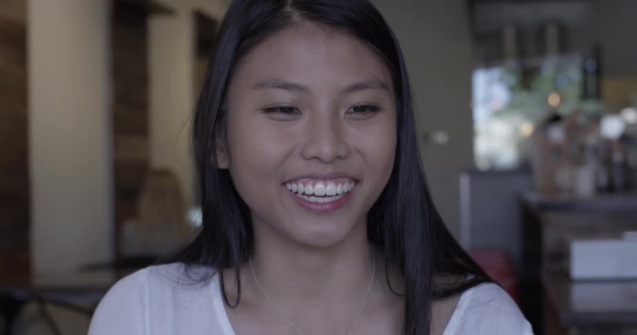 Woman laughing and talking