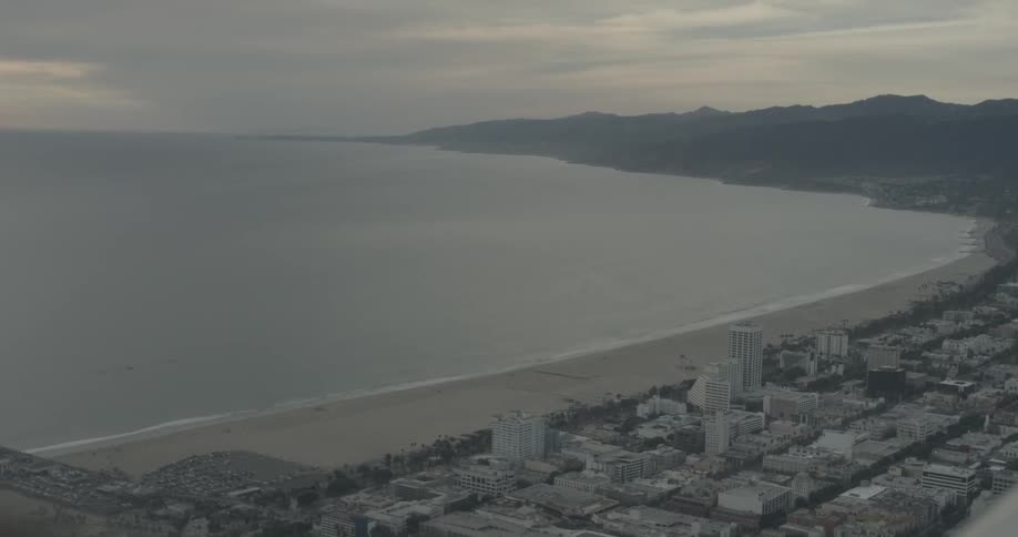 The water is still along the beach