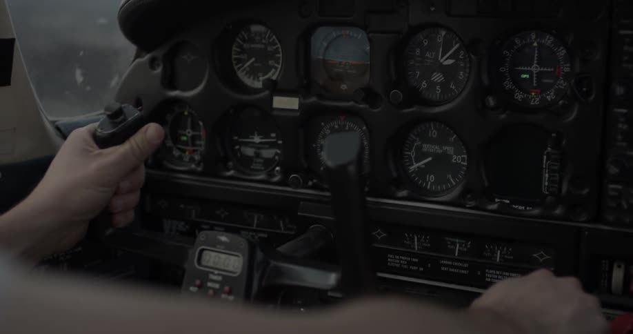Hands are at the controls of an aircraft
