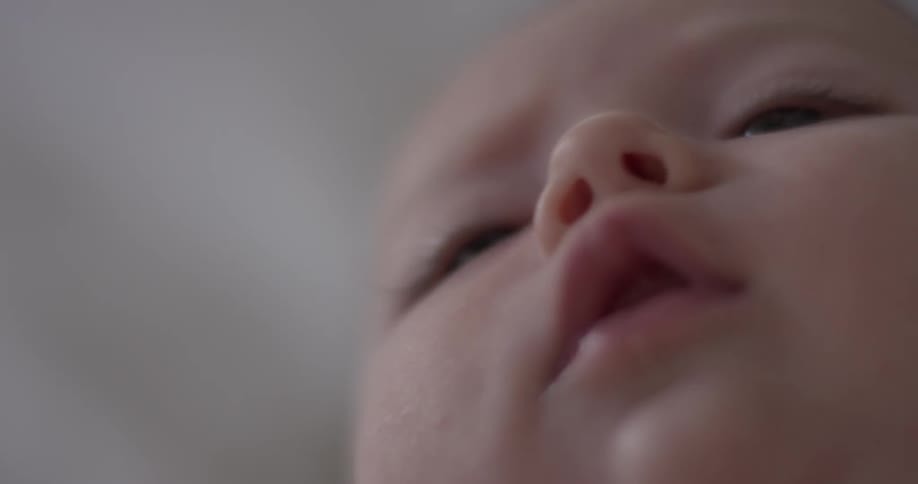 Close up of baby's face while laying down