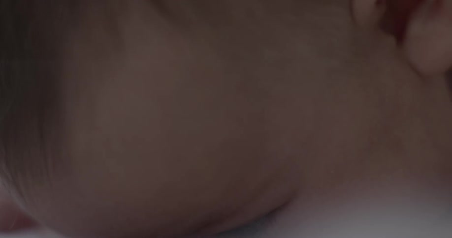 Baby laying on stomach lifts head
