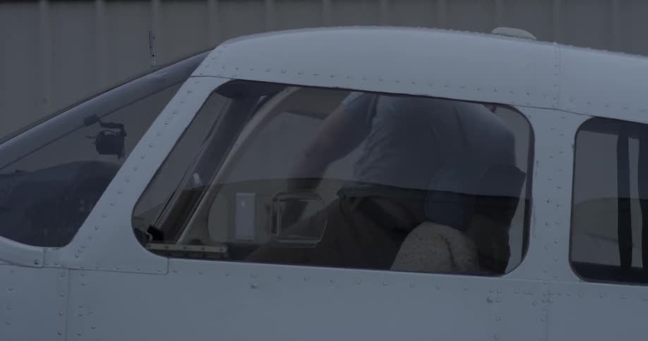 A man steps out of a plane