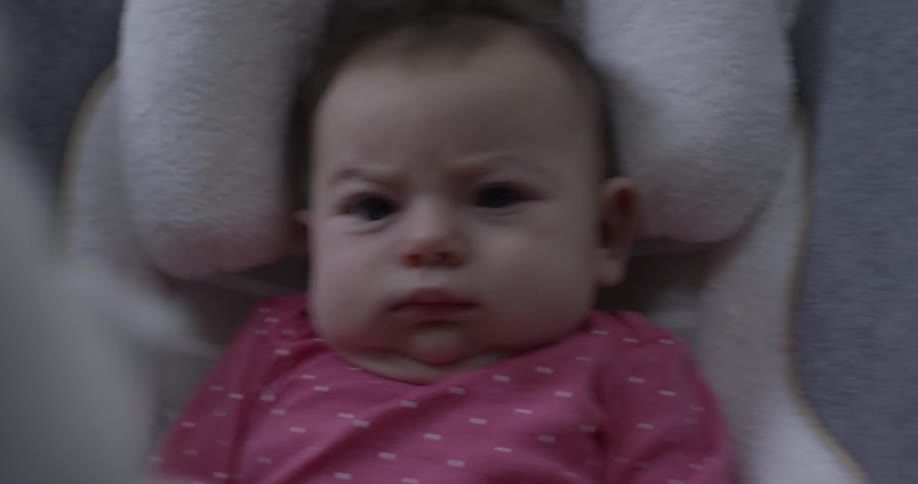 Mad baby gets rocked in chair