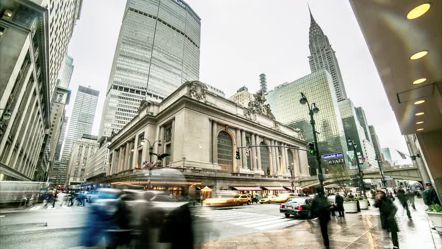 Time lapses as people move around a street scene
