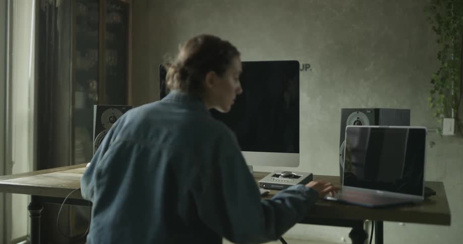 Woman Working On Computer In Studio