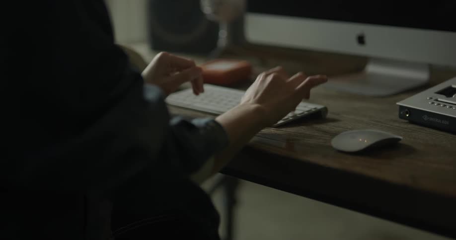 Woman Working On Computer In Studio