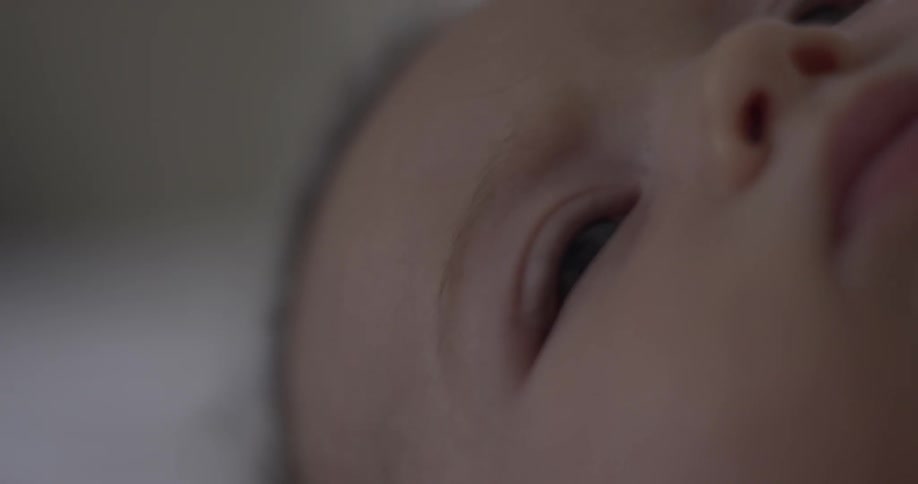 Baby looks around at close things