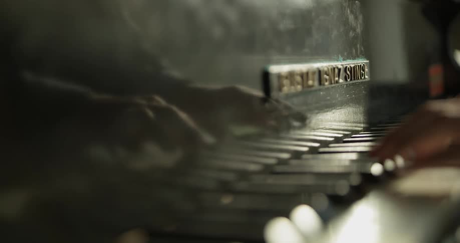 A man is playing piano inside