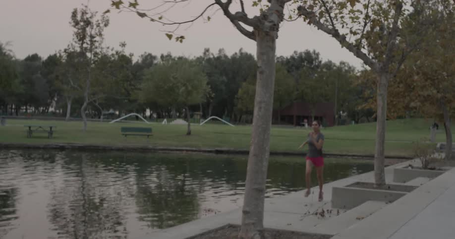 A woman is jogging outside