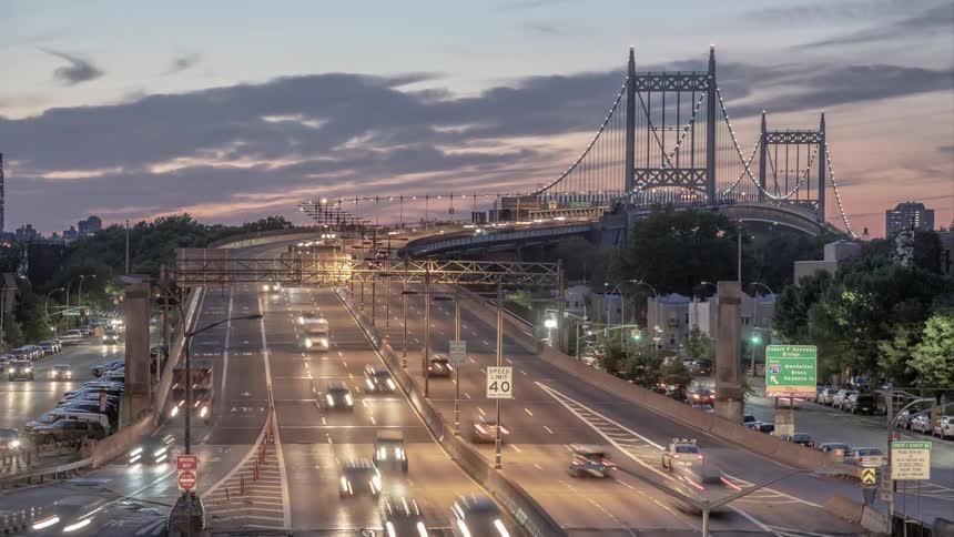 Cars driving on a highway at dusk
