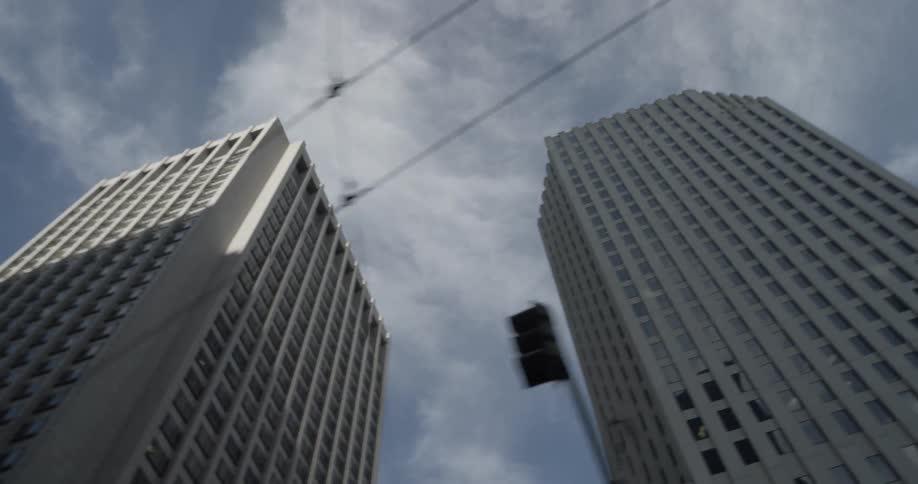 Tall city buildings tower into the sky