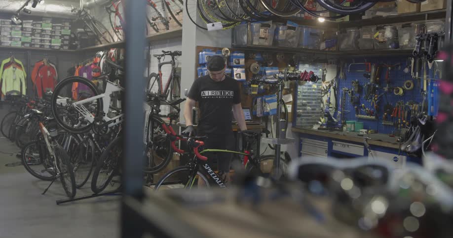Man drops bicycle and bounces it to check the tires