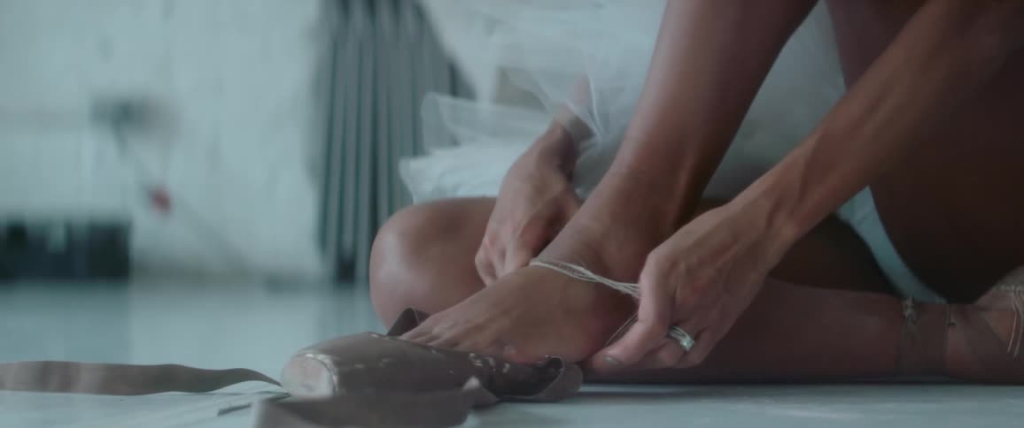 A person putting on a flip flop