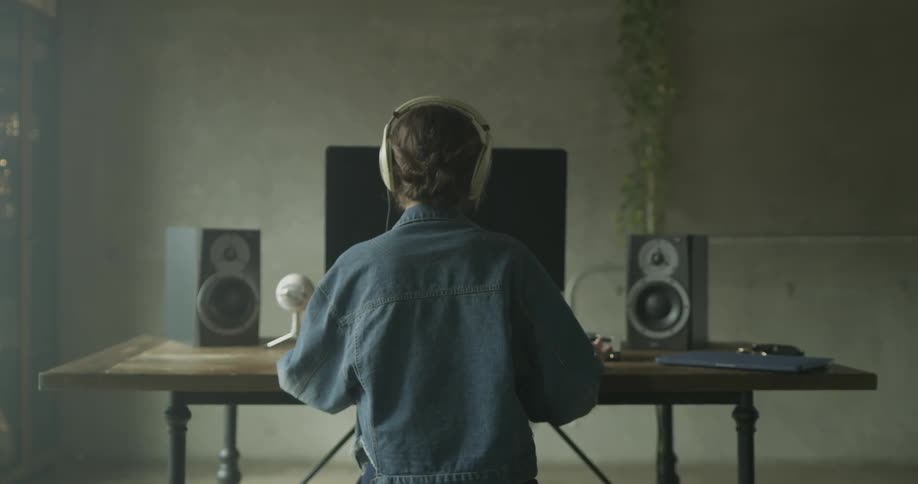 Woman Working On Computer In Studio