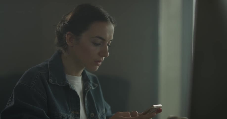 Woman typing on smartphone