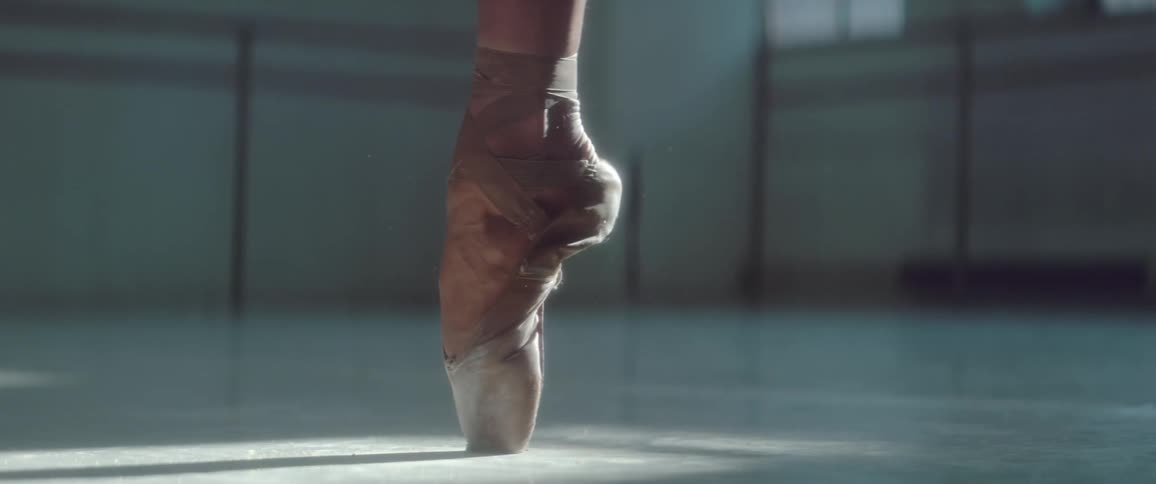 A ballet dancer spins on her toes