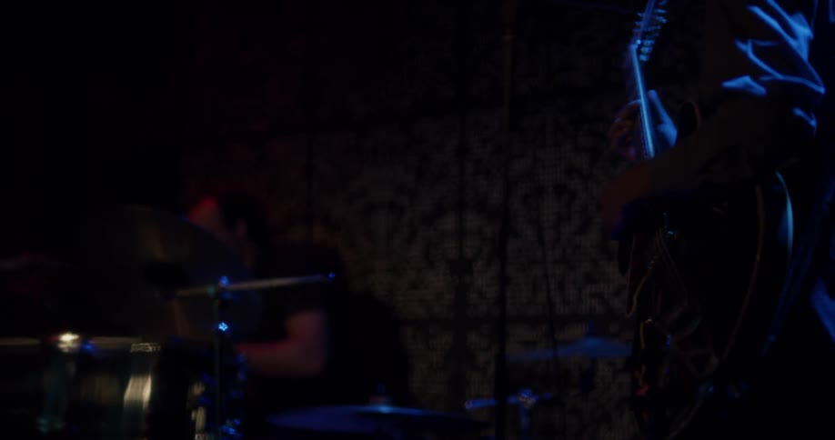 Drum and guitar player on a stage