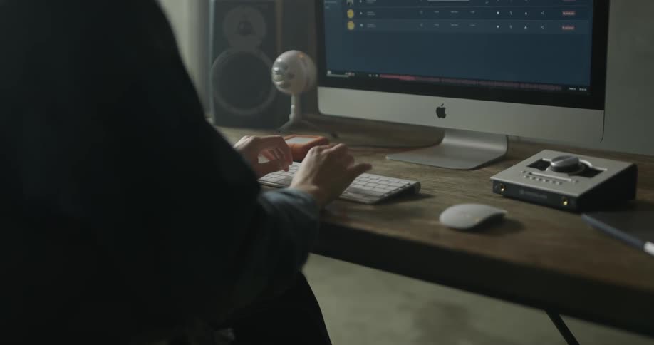 Woman Working On Computer In Studio