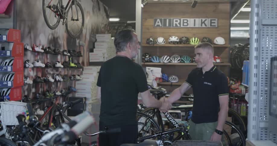 Two men work in a bike shop