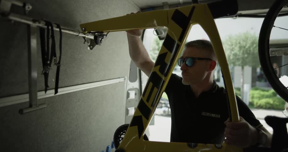 A man is connecting pieces in a vehicle