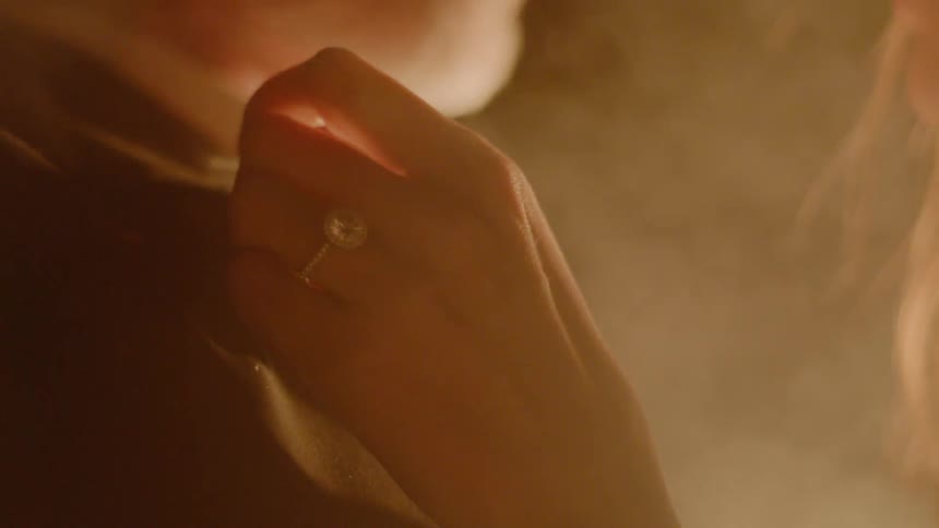 Couple Kissing By Fire In Desert