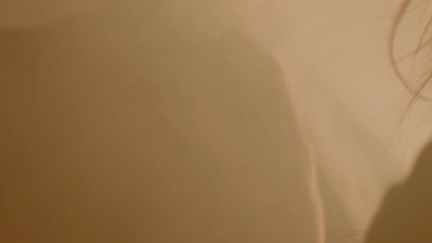 A man and woman are next to each other near smoke