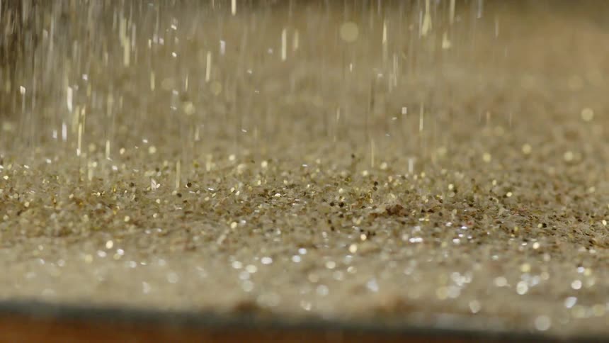 Sand that is falling on a table