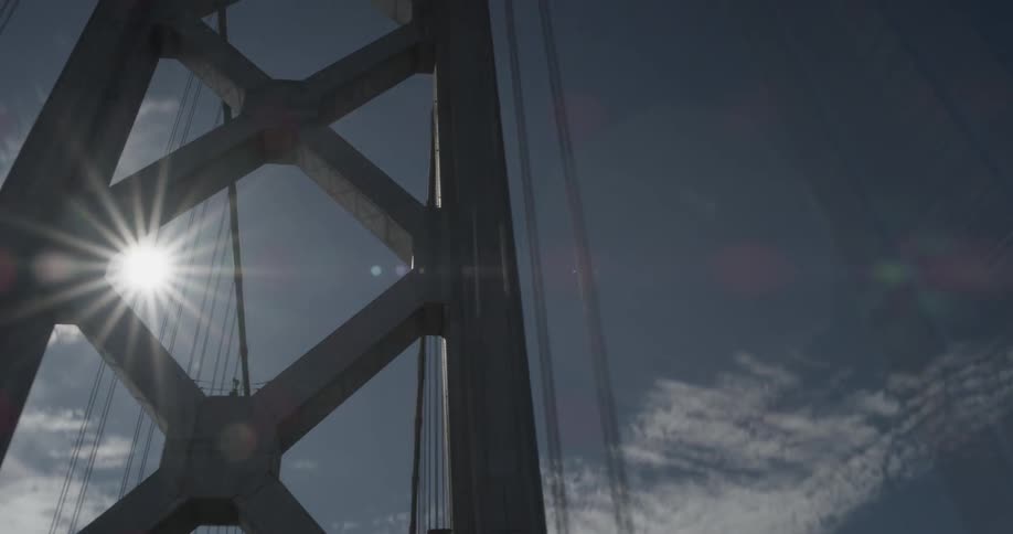 A car travels over a large bridge