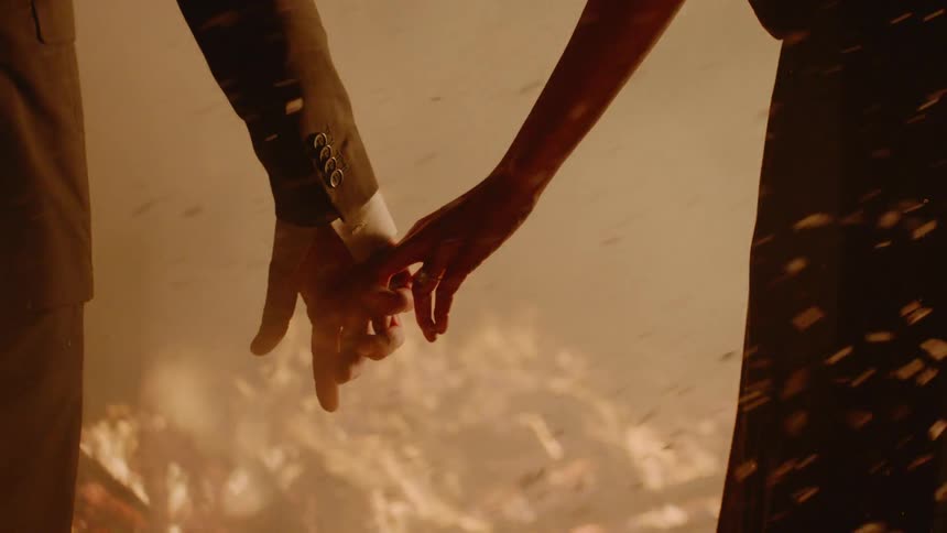Couple Kissing By Fire In Desert