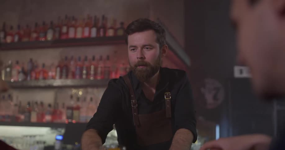 Bartender serves a drink